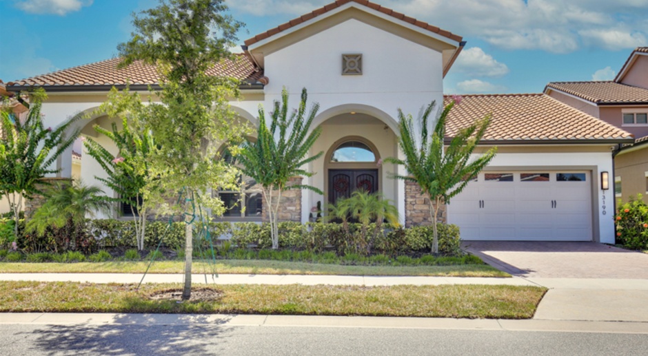 Luxurious 4/4 Executive Pool Home with a 3 Car Garage Including Full Pool and Lawn Care Services Located on a Golf Course in Eagle Creek Village - Orlando!