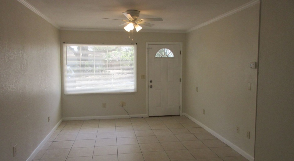 Altamonte 3 bedroom 1 bath home with all tile floors, 1 car garage with laundry area and fenced back yard