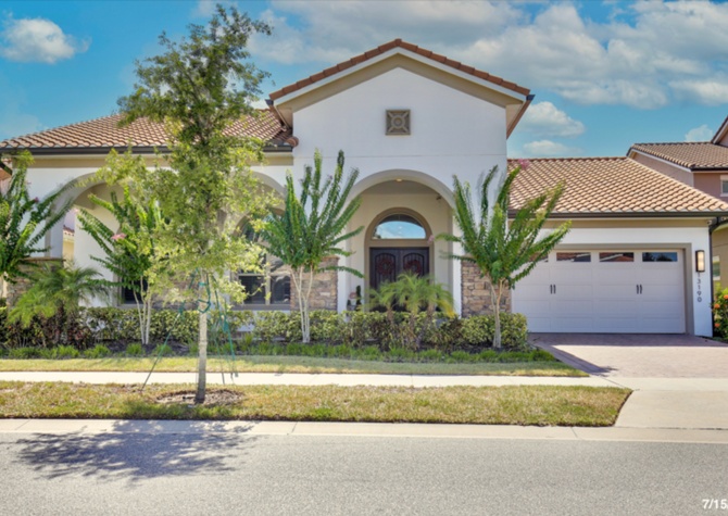 Houses Near Luxurious 4/4 Executive Pool Home with a 3 Car Garage Including Full Pool and Lawn Care Services Located on a Golf Course in Eagle Creek Village - Orlando!