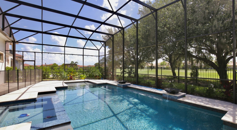 Luxurious 4/4 Executive Pool Home with a 3 Car Garage Including Full Pool and Lawn Care Services Located on a Golf Course in Eagle Creek Village - Orlando!