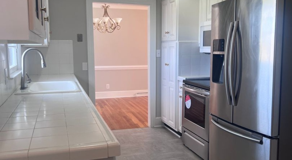 NEW Stainless Appliances and Flooring in the Kitchen, NEW Carpet and Fresh Paint Throughout!